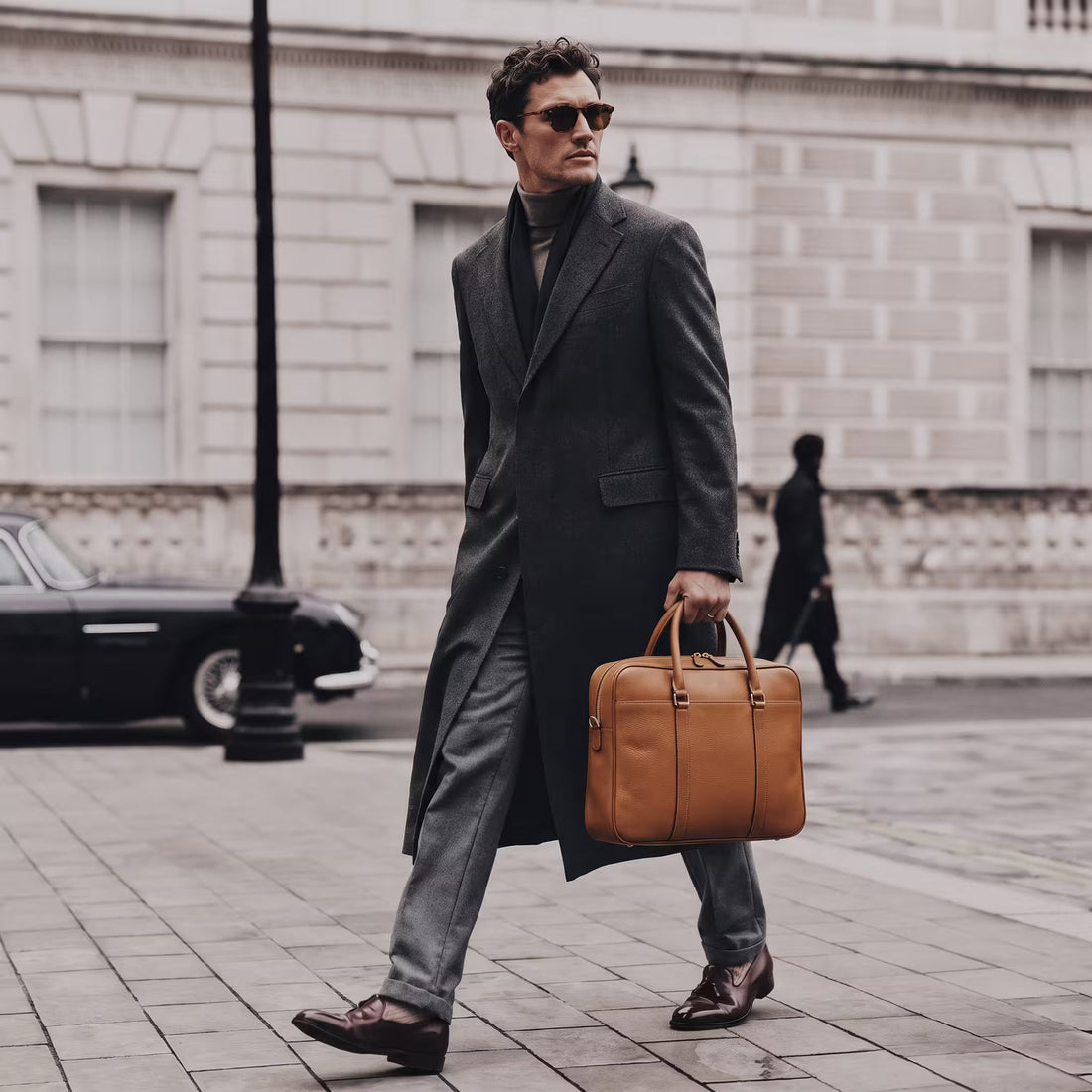 Camel Prestige Briefcase carried by a model on a city sidewalk